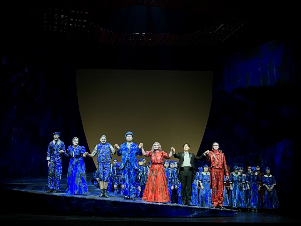 Opera curtain call in blue lighting